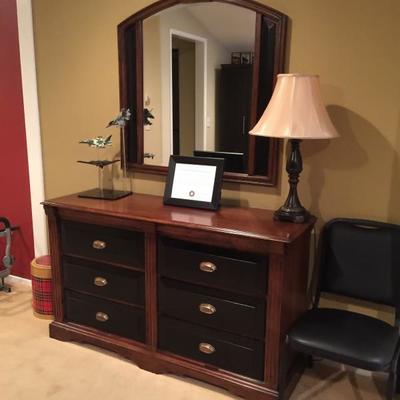 Upstairs bedroom dresser with mirror and decor accessories 