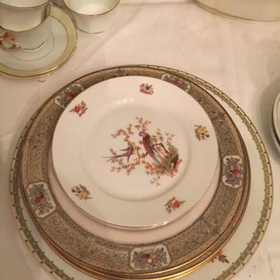 English bread plates along with pieces of US Belleek China