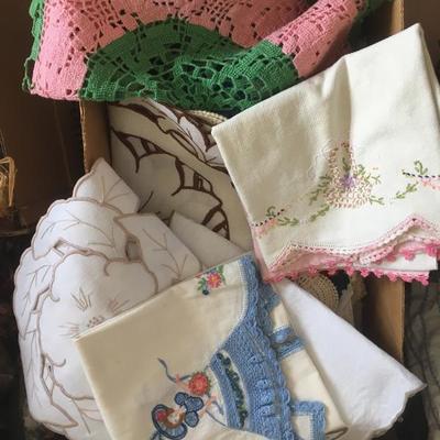 many linens and vintage dish cloths