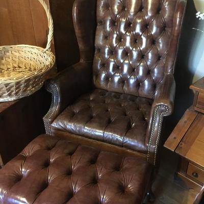 leather (?) wing chair & ottoman