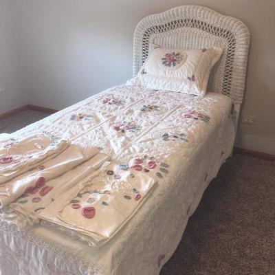 twin sized bed and wicker headboard