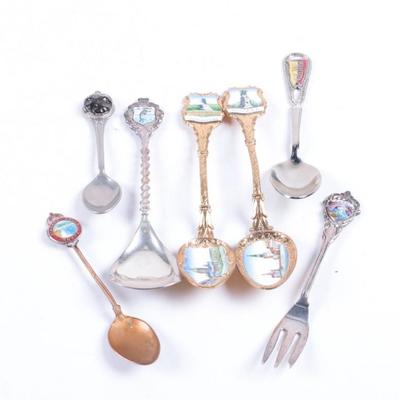 Silver and Gold Tone Metal Souvenir Spoons   
https://www.ebth.com/items/7388341-silver-and-gold-tone-metal-souvenir-spoons