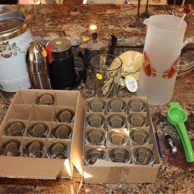 Box lot of barware, shot glasses, pitcher, coffee  grinder, bottle opener, small keg, etc.

