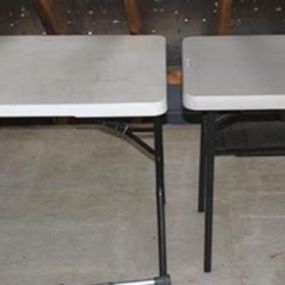 Pair of white folding tables, located on 2nd  floor, bring manpower
