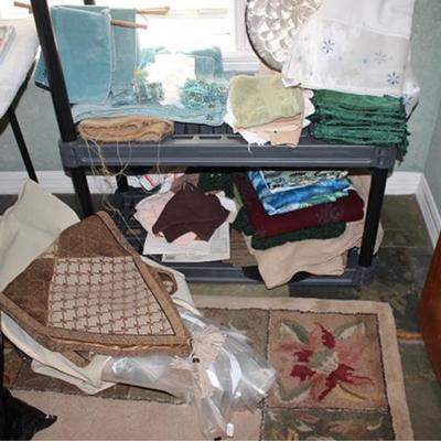 Box lot of many linens napkins, table runners,  place mats, towels, napkin rings, down comforter,  etc.
