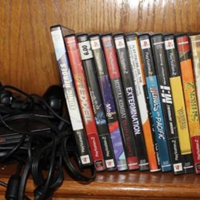 Playstation 2 with games and two controllers
