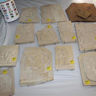 Box lot of reproduction Mayan wall hanging  plaques, world map, and flag
