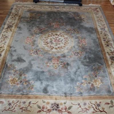 8' x 11' handmade wool rug, blue with floral  design, located on 2nd floor, bring manpower

