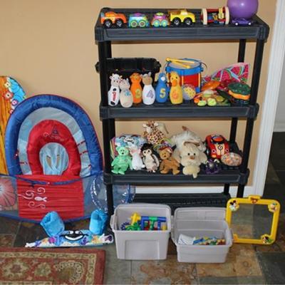 Box lot of children's toys, blocks, stuffed  animals, cars, pool floats, shelving not included
