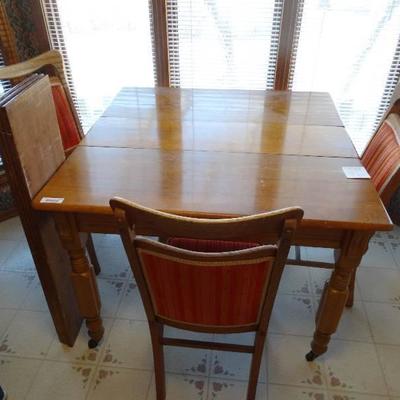 100 years old wooden table w/ 4 leaves & 3 chairs