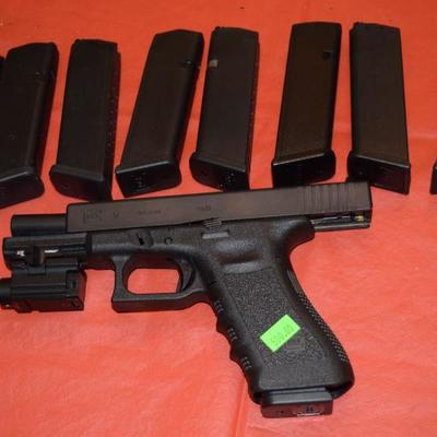 Glock - 19 .9mm with (9) magazines and laser.