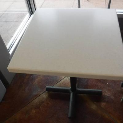 24 x 24 x 30 tall table has a corion type top