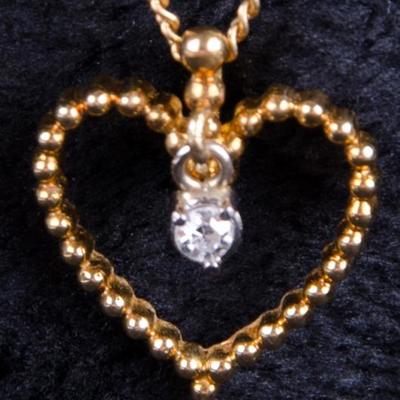  18kt Gold Open Heart Pendant with Single Diamond  http://www.ctonlineauctions.com/detail.asp?id=671823