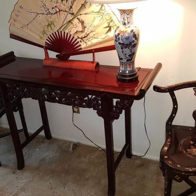 Sofa table and Asian corner chairs accented with Mother of Pearl
