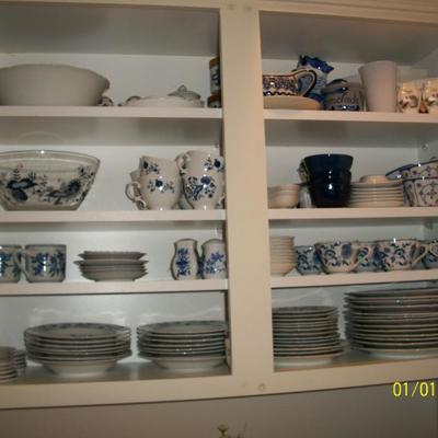 The Blue Danube Dinnerware set in the cupboard.
