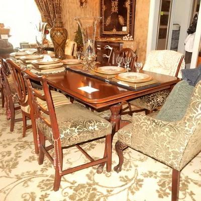 Triple Pedestal table by drexel, has two upholstered arm chairs in a soft leaf design with 6 chairs of the same fabric and 4 chairs of a...