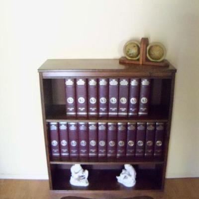 Bookcase and set of several vintage National Geographic issues.