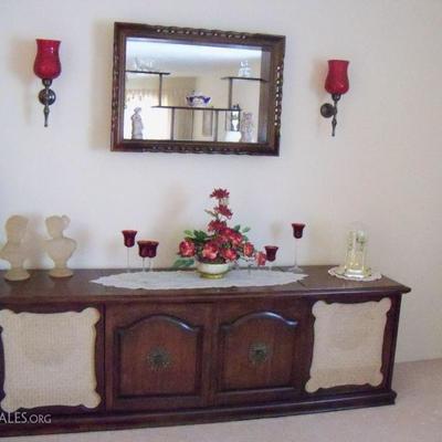 Vintage stereo record cabinet, stereo receiver tuner and turntable, cranberry wall sconces and beautiful display with mirror.