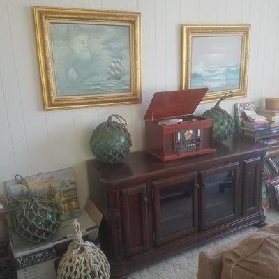 Many fishing floats..solid wood cabinet