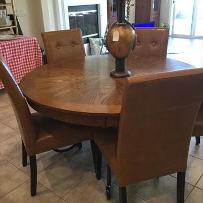 Dining table with pier one leather chairs ! $250 for set - located 5 min away at our other location if your interested in this set -...