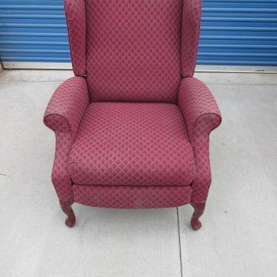 Tall back low arm sitting chair