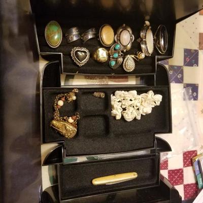 large quantity of gold, silver, and gemstone jewelry. Many with appraisals but, only on premises during business hours.
