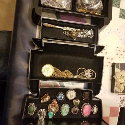 large quantity of gold, silver, and gemstone jewelry. Many with appraisals but, only on premises during business hours.
