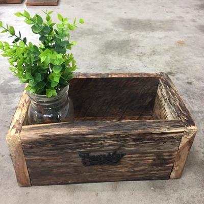 Wooden box with greenery