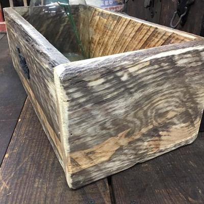 Wooden box with greenery