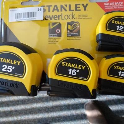 4 Stanley lever lock tape measures. 1- 25' 1- 16' ...