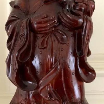set of three hand carved wood figures of healthy, happy, and wealth
