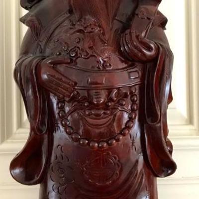 set of three hand carved wood figures of healthy, happy, and wealth
