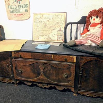 Antique cabinet, Raggedy Ann doll, and bench seat from Crawfordsville courthouse