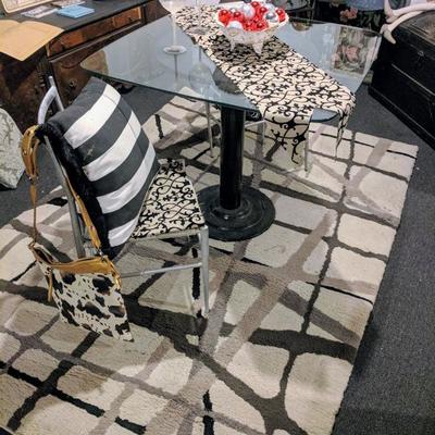Table with chairs, rug, and decorative pieces (all priced individually)