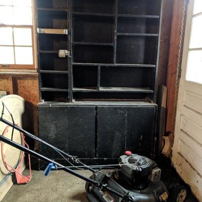 Push mower and black garage cabinet