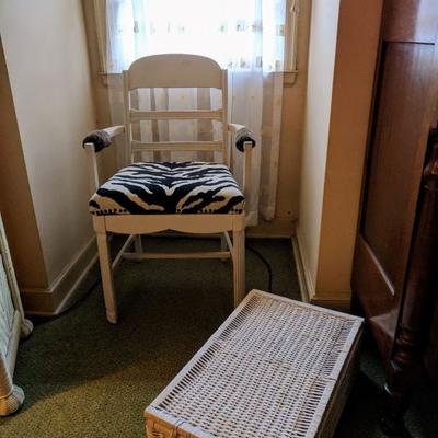 Zebra print chair and wicker storage basket