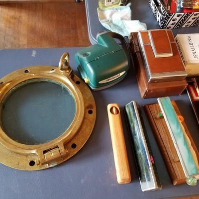 Antique brass porthole, vintage cameras 