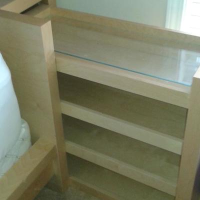 Night stands be stored behind bed