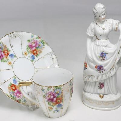 Occupied Japan Porcelain Demitasse Cup and Saucer with wire stand shown with Japan Porcelain 6" Lady Figurine