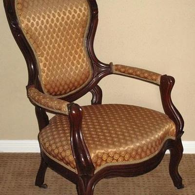 Antique Rosewood Upholstered Gentleman's Chair, Cabriole Legs with original Casters 