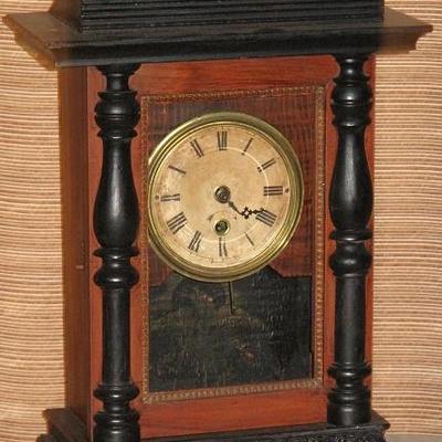 Antique Mantle Clock with black trim and finials, Key Wound Eagle on back panel. No other identifying marks.  (18.5