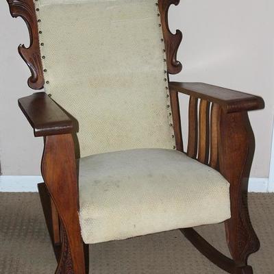 Antique Golden Rocker with Carved Griffins on either side of back.  