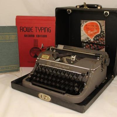 Vintage 1938 Underwood Champion Portable Typewriter with Carrying Case shown with the "Rowe Typing" Second Edition January 1,...