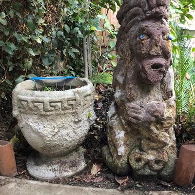 Large cement urn and tiki god 