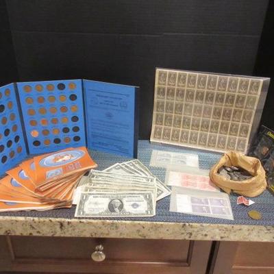 Pennies, blue chip books, silver certificates, nickels, and stamps.