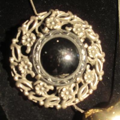 Vintage silver with black center stone broche