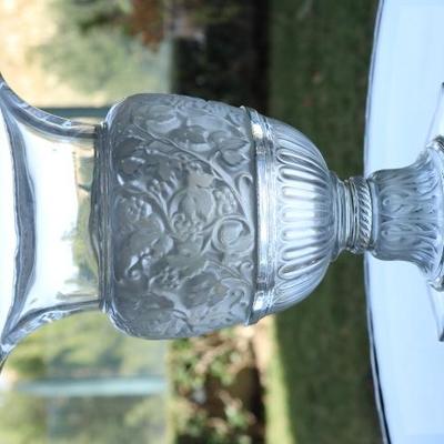 1) Lalique Versailles crystal vase - signed on the front, numbered 285 on the bottom.  
Size: 14 Inches High x 9.25 Inches Wide
Asking...