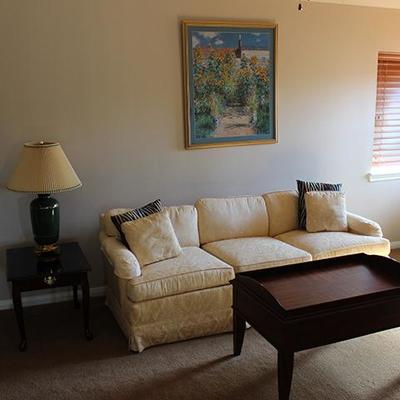 White sofa, coffee table, end table lamp