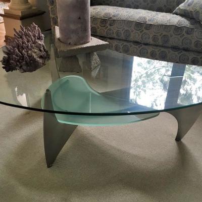 boomerang shaped coffee table with glass top & stainless steel base
