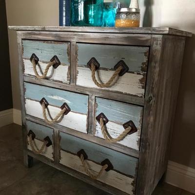 Distressed small dresser used in dining room
